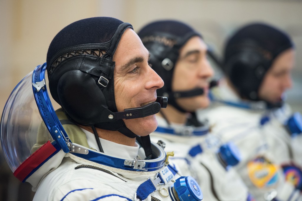 Expedition 63 crewmembers Chris Cassidy of NASA, left, Anatoly Ivanishin and Ivan Vagner of Roscosmos, right, talk to mission managers prior to departing for the launch pad, Thursday, April 9, 2020 at the Baikonur Cosmodrome in Kazakhstan. A few hours later, they lifted off on a Soyuz rocket for a six-and-a-half month mission on the International Space Station.