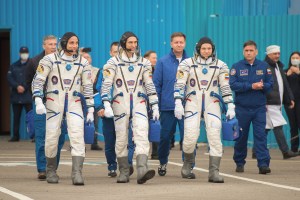Expedition 63 crewmembers Chris Cassidy of NASA, left, Anatoly Ivanishin, center, and Ivan Vagner of Roscosmos, depart building 254 for the launch pad, Thursday, April 9, 2020 at the Baikonur Cosmodrome in Kazakhstan. A few hours later, they lifted off on a Soyuz rocket for a six-and-a-half month mission on the International Space Station.