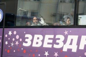 Expedition 63 crewmembers Chris Cassidy of NASA, left, Ivan Vagner and Anatoly Ivanishin of Roscosmos wave farewell as they depart for the launch pad, Thursday, April 9, 2020 at the Baikonur Cosmodrome in Kazakhstan. A few hours later, they lifted off on a Soyuz rocket for a six-and-a-half month mission on the International Space Station.