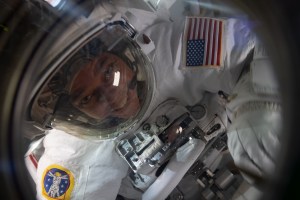NASA astronaut and Expedition 63 Flight Engineer Bob Behnken is pictured in his U.S. spacesuit inside the crew lock portion of the Quest airlock nearing the end of a spacewalk to replace batteries on the International Space Station's Starboard-6 truss structure.