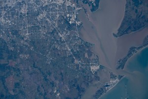 Galveston, Texas (lower right) separates the Gulf of Mexico from Galveston Bay and Trinity Bay. At upper left is Houston in this photograph taken by an Expedition 61 crewmember aboard the International Space Station taken from an altitude of 256 miles.