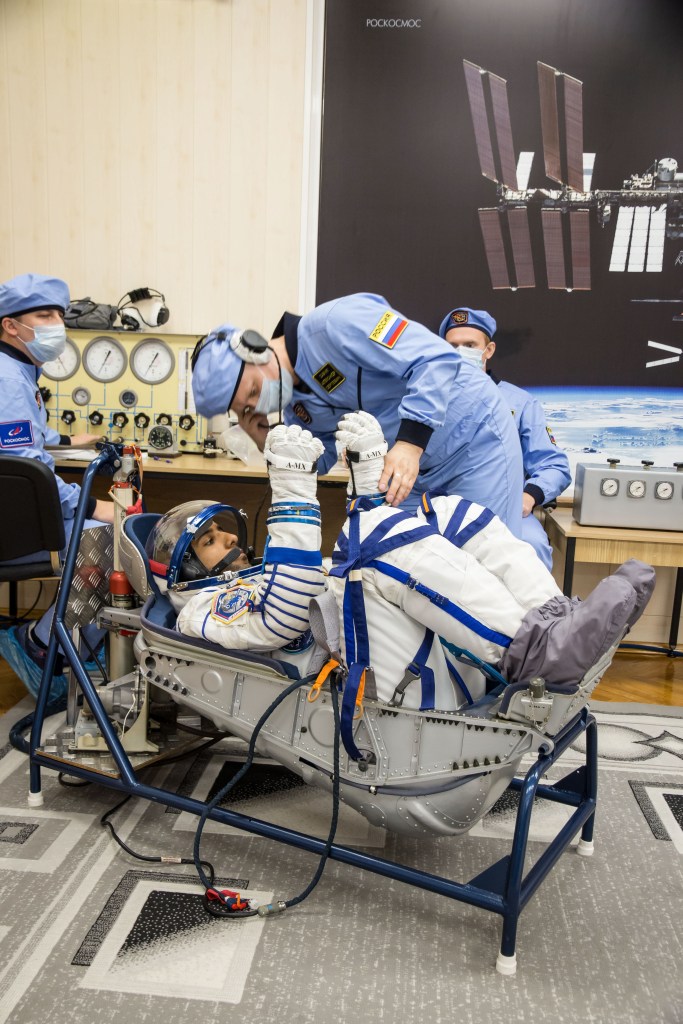 In the Integration Building at the Baikonur Cosmodrome in Kazakhstan, spaceflight participant Hazzaa Ali Almansoori of the United Arab Emirates undergoes a pressure and leak check of his Russian Sokol launch and entry suit Sept. 11 for a fit check aboard the Soyuz MS-15 spacecraft. Almansoori and Expedition 61 crewmembers Jessica Meir of NASA and Oleg Skripochka of Roscosmos will launch Sept. 25 on the Soyuz MS-15 spacecraft from the Baikonur Cosmodrome for a mission on the International Space Station.