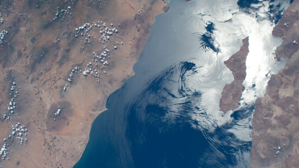 The sun's glint beam's off of the Gulf of California highlighting Archangel Island, which is part of the Mexican state of Baja California, in this photograph from the International Space Station as it orbited 258 miles above.
