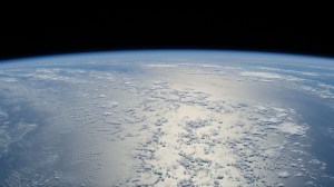 The sun's glint beams off a tranquil, blue Atlantic Ocean in this photograph from the International Space Station as it orbited 261 miles above and east of the The Bahamas.