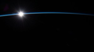The first rays of an orbital sunrise penetrate Earth's atmosphere in this photograph from the International Space Station as it orbited 263 miles above the Atlantic Ocean off the coast of the Canadian island of Newfoundland.