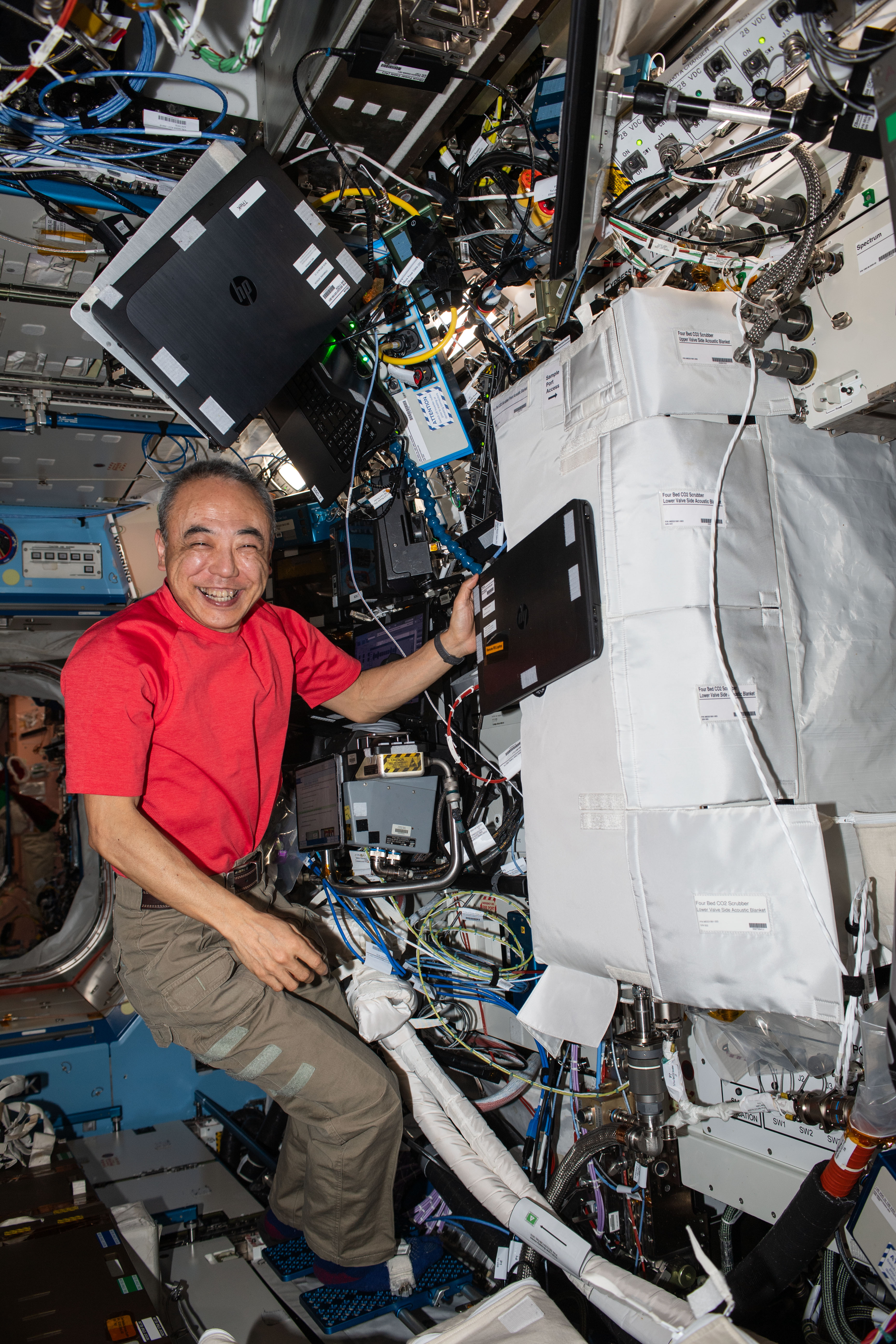 JAXA (Japan Aerospace Exploration Agency) astronaut and Expedition 70 Flight Engineer Satoshi Furukawa works on carbon dioxide removal hardware inside the International Space Station's Destiny laboratory module.