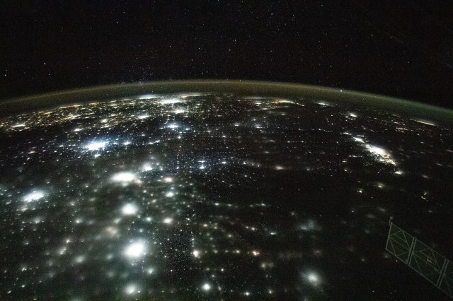 The city lights of North America appear under Earth's airglow and a starry night sky in this photograph from the International Space Station as it orbited 262 miles above North Dakota.