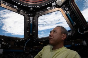 JAXA (Japan Aerospace Exploration Agency) astronaut and Expedition 70 Flight Engineer Satoshi Furukawa peers at the Earth from inside the International Space Station's "window to the world," also known as the cupola. The orbital lab was soaring 274 miles above the south Atlantic Ocean at the time of this photograph.