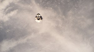 The SpaceX Dragon Freedom spacecraft carrying the four-member Axiom Mission 3 (Ax-3) crew is pictured approaching the International Space Station 264 miles above a cloudy Indian Ocean east of the coast of Madagascar.