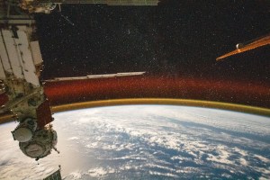 This high exposure photograph from the International Space Station shows Earth's atmospheric glow and a starry sky as the orbital complex soared 258 miles above the Pacific Ocean northeast of Papua New Guinea. At left, are the station's Nauka science module and the Prichal docking module, both from Roscosmos.