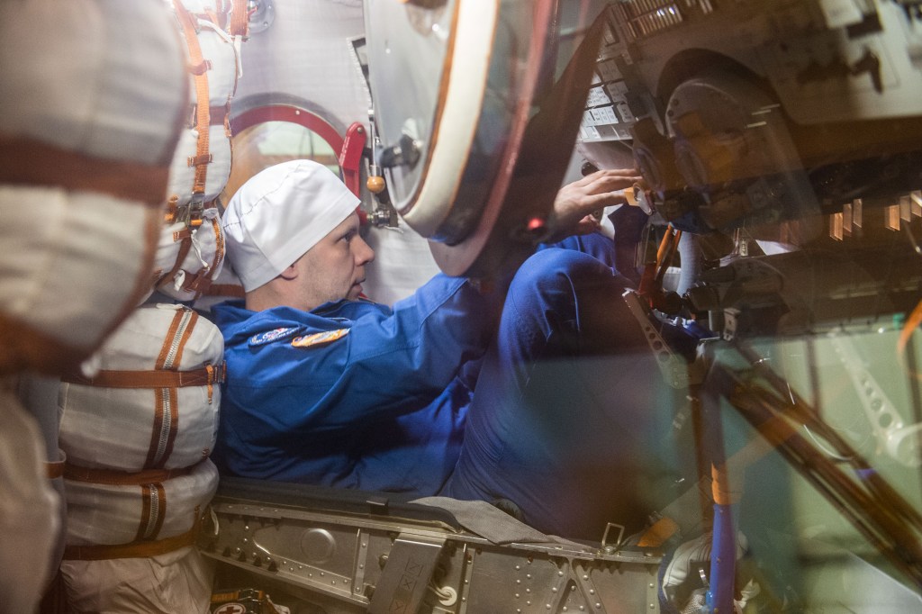 At the Baikonur Cosmodrome in Kazakhstan, Expedition 63 crewmember Ivan Vagner of Roscosmos runs through procedures during a pre-launch training session in the Soyuz MS-16 spacecraft March 25. Vagner, Anatoly Ivanishin of Roscosmos and Chris Cassidy of NASA will launch April 9 on the Soyuz from Baikonur for a six-and-a-half month mission on the International Space Station...Andrey Shelepin/Gagarin Cosmonaut Training Center.