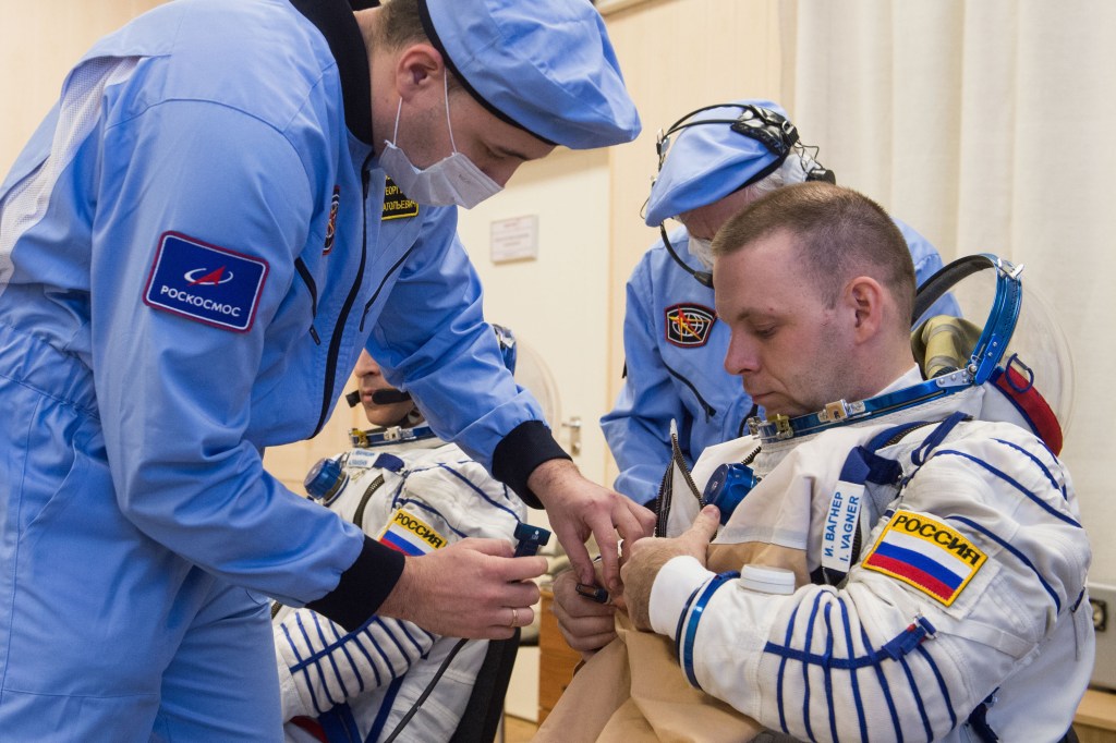 At the Baikonur Cosmodrome in Kazakhstan, Expedition 63 crewmember Ivan Vagner of Roscosmos suits up March 25 for pre-launch training activities. Vagner, Anatoly Ivanishin of Roscosmos and Chris Cassidy of NASA will launch April 9 on the Soyuz MS-16 spacecraft from Baikonur for a six-and-a-half month mission on the International Space Station. Credit: Andrey Shelepin/Gagarin Cosmonaut Training Center.