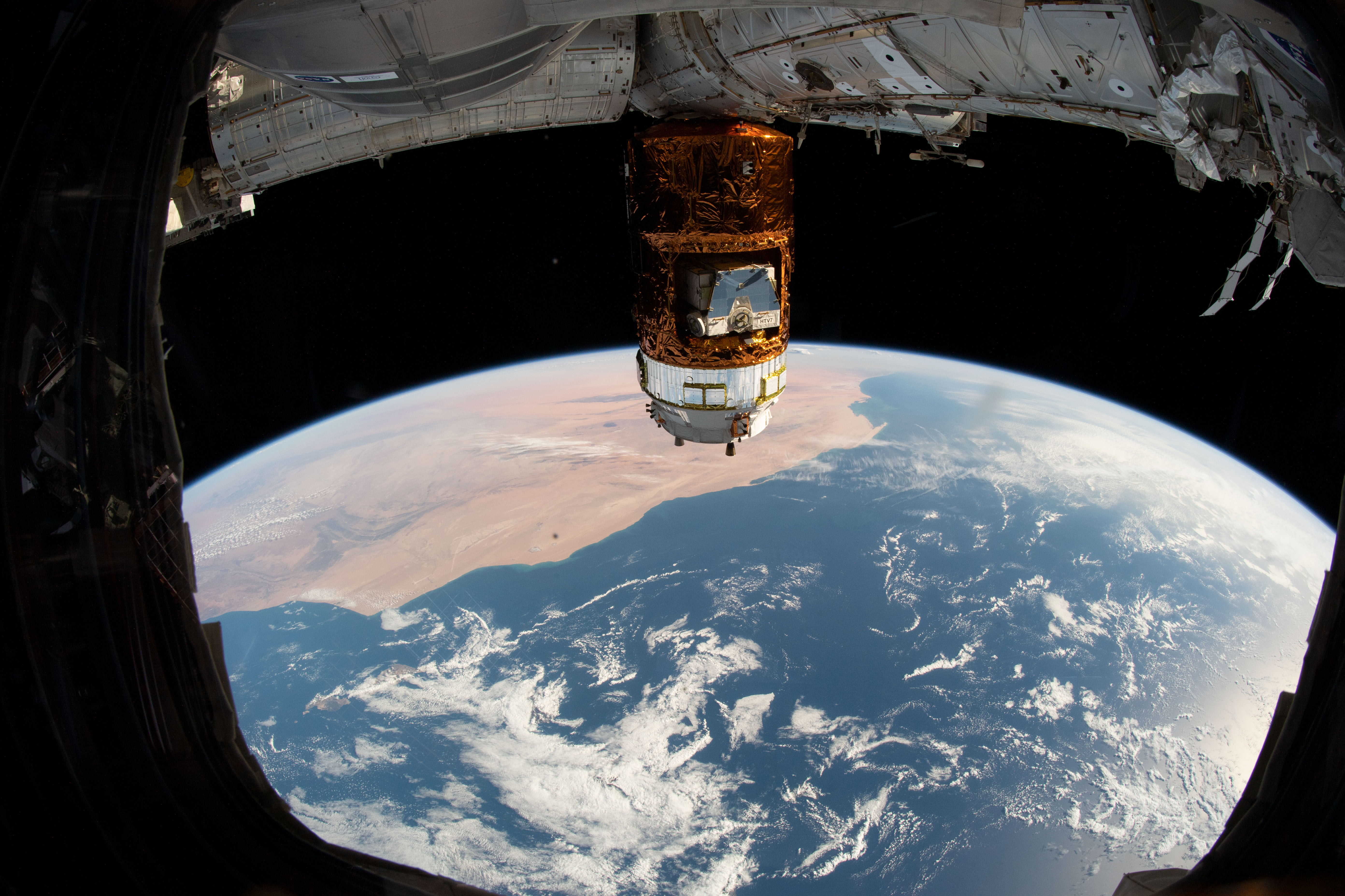 Japan's H-II Transfer Vehicle-8 (HTV-8) highlights this image as the International Space Station orbited 253 miles above the Atlantic Ocean. This view from the orbiting complex looks across Morocco and Western Sahara.