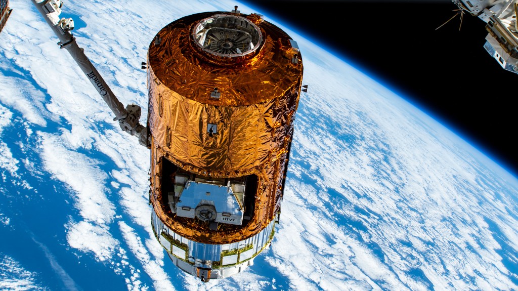 Japan's H-II Transfer Vehicle-8 (HTV-8) is pictured in the grips of the Canadarm2 robotic arm after ground controllers remotely detached the HTV-8 from the International Space Station's Harmony module. NASA astronauts Christina Koch and Jessica Meir would command the Canadarm2 to release the HTV-8 after a 34 day cargo mission at the orbiting lab.