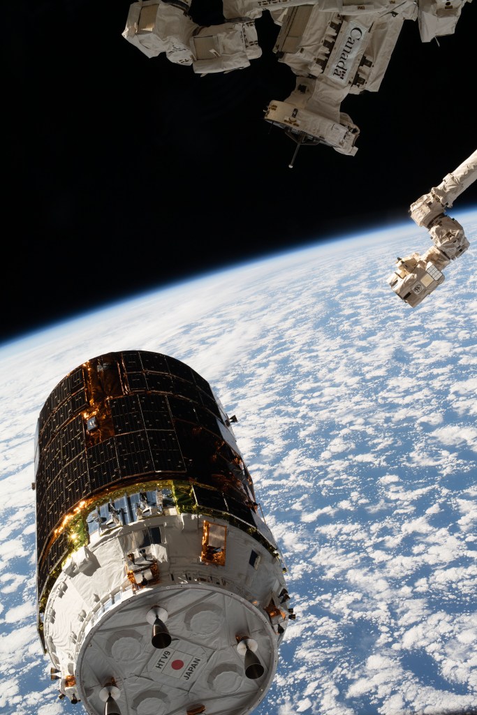 The H-II Transfer Vehicle-9 (HTV-9) from JAXA (Japan Aerospace Exploration Agency) is pictured moments before the Canadarm2 robotic arm (right) captured the resupply ship. Expedition 63 Commander Chris Cassidy was at the robotics controls ready to command the Canadarm2 to reach out and grapple the HTV-9 that was carrying over four tons of food, supplies and experiments to replenish the International Space Station crew.