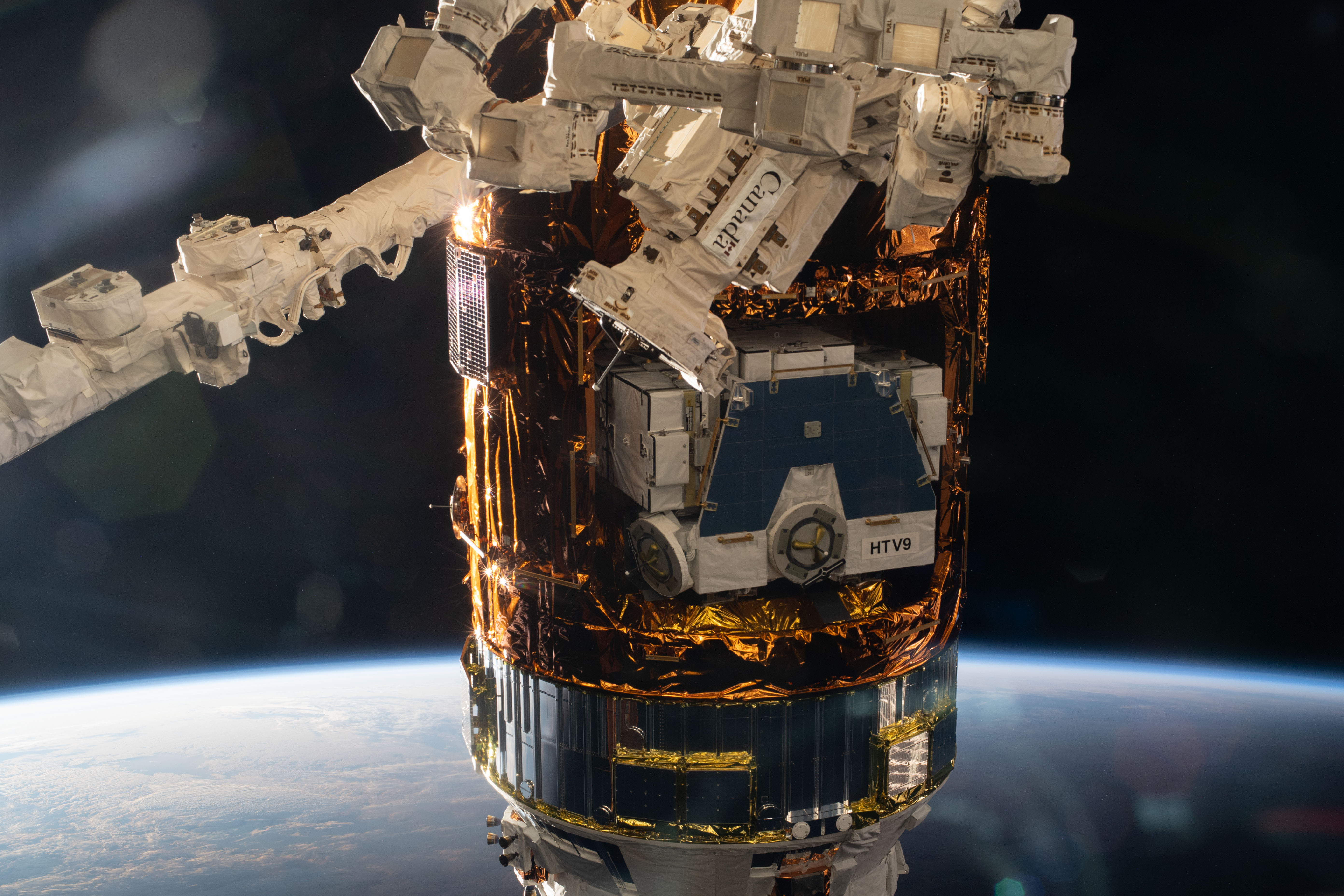 JAXA's (Japan Aerospace Exploration Agency) H-II Transfer Vehicle-9 (HTV-9) is pictured after its capture and installation with the Canadarm2 robotic arm to the Harmony module following a five-day trip to the International Space Station. The HTV-9 was carrying over four tons of food, supplies and experiments to replenish the Expedition 63 crew.