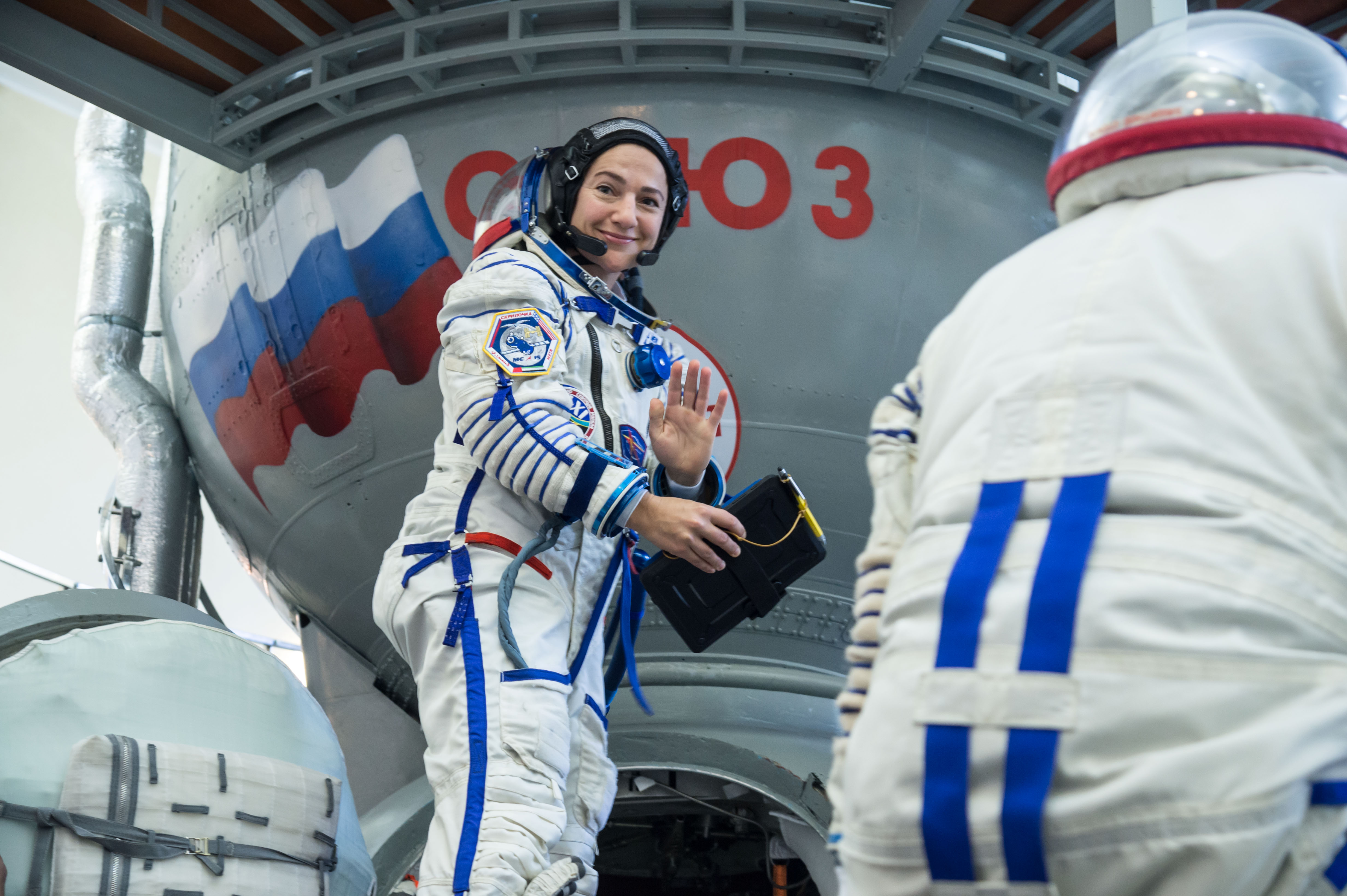 At the Gagarin Cosmonaut Training Center in Star City, Russia, Expedition 61 crewmember Jessica Meir of NASA climbs aboard a Soyuz trainer during final crew qualification exams Aug. 30. Meir will launch with Expedition 61 crewmember Oleg Skripochka of Roscosmos and spaceflight participant Hazzaa Ali Almansoori of the United Arab Emirates Sept. 25 on the Soyuz MS-15 spacecraft from the Baikonur Cosmodrome in Kazakhstan for a mission on the International Space Station.