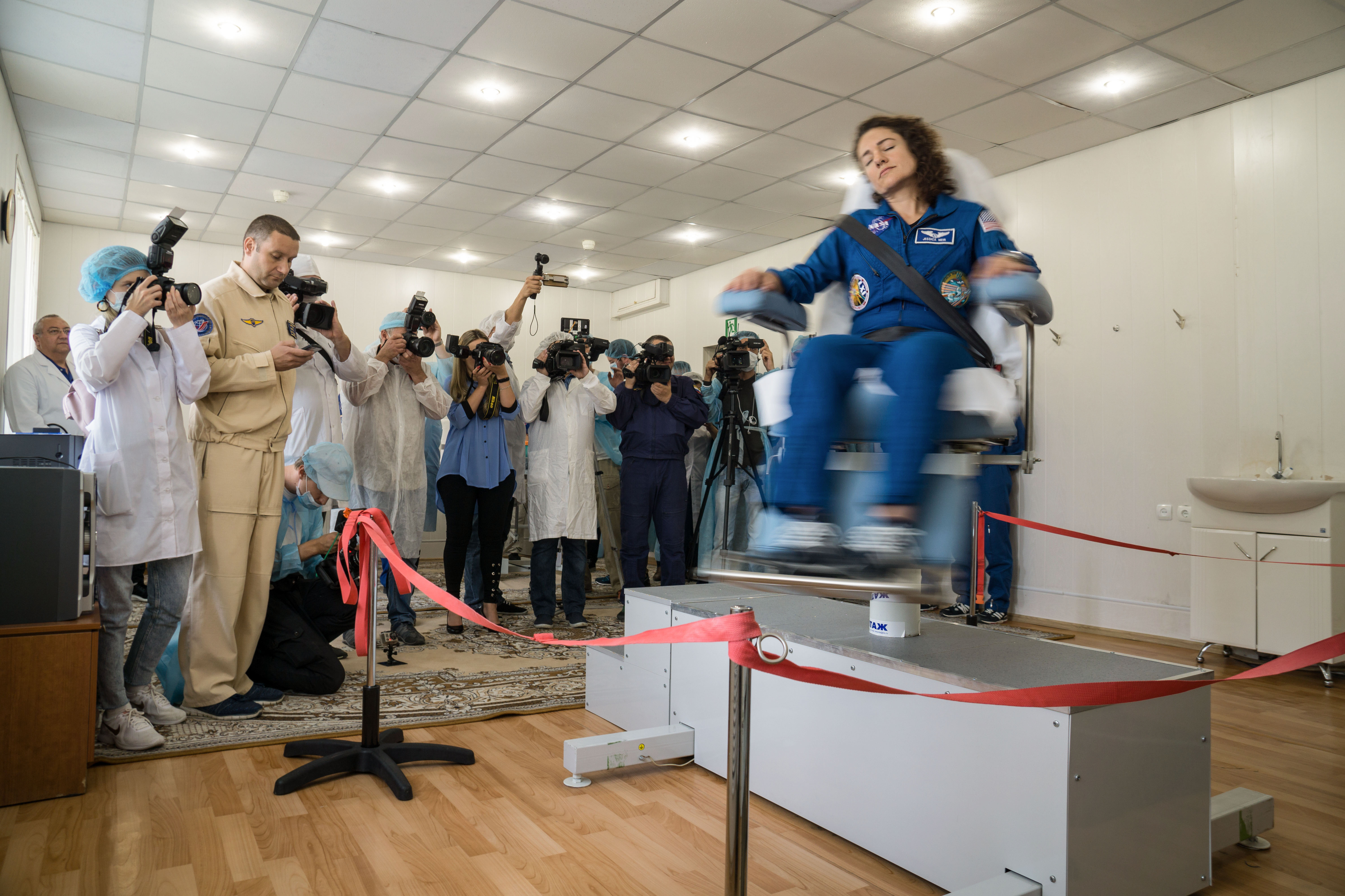 At the Cosmonaut Hotel crew quarters in Baikonur, Kazakhstan, Expedition 61 crewmember Jessica Meir of NASA takes a spin in a rotating chair Sept. 18 to test her vestibular system as part of pre-launch activities. Along with Oleg Skripochka of Roscosmos and spaceflight participant Hazzaa Ali Almansoori of the United Arab Emirates, they will launch Sept. 25 from the Baikonur Cosmodrome in Kazakhstan on the Soyuz MS-15 spacecraft for a mission on the International Space Station.