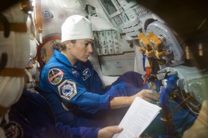 In the Integration Building at the Baikonur Cosmodrome in Kazakhstan, Expedition 61 crewmember Jessica Meir of NASA runs through procedures Sept. 11 aboard the Soyuz MS-15 spacecraft during an initial Soyuz vehicle fit check. Meir, spaceflight participant Hazzaa Ali Almansoori of the United Arab Emirates and Expedition 61 crewmember Oleg Skripochka of Roscosmos will launch Sept. 25 on the Soyuz MS-15 spacecraft from the Baikonur Cosmodrome for a mission on the International Space Station.