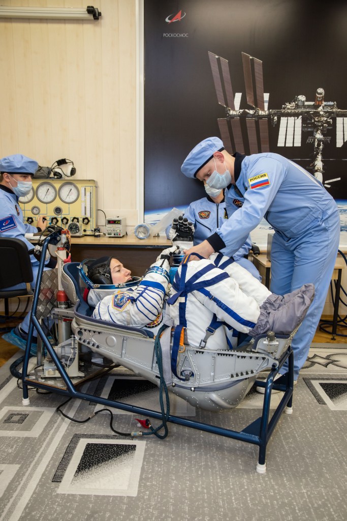 In the Integration Building at the Baikonur Cosmodrome in Kazakhstan, Expedition 61 crewmember Jessica Meir of NASA undergoes a pressure and leak check of her Russian Sokol launch and entry suit Sept. 11 for a fit check aboard the Soyuz MS-15 spacecraft. Meir, Hazzaa Ali Almansoori of the United Arab Emirates and Expedition 61 crewmember Oleg Skripochka of Roscosmos will launch Sept. 25 on the Soyuz MS-15 spacecraft from the Baikonur Cosmodrome for a mission on the International Space Station.