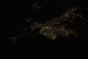 Los Angeles, California is pictured at night as the International Space Station was orbiting 257 miles above the Pacific Ocean and about 215 miles southwest of the L.A. coastline. The bright orange lights at the center are Terminal Island and the Port of Los Angeles.