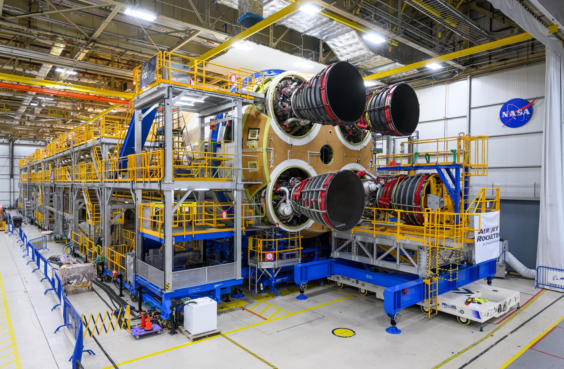 This photo shows how technicians at NASA’s Michoud Assembly Facility in New Orleans install the RS-25 engines onto the core stage for the agency’s SLS (Space Launch System) rocket that will help power NASA’s first crewed Artemis mission to the Moon.