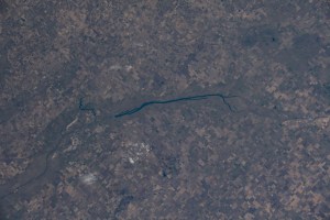 McDonald Lake in Saskatchewan, Canada, is pictured as the International Space Station orbited 254 miles above North America. The coal-mining city of Estevan, at the lake's southeast end surrounded by prairies and farms, is 10 miles north of the United States border of North Dakota.