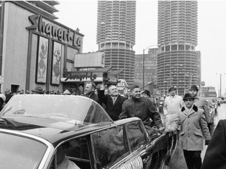 Lovell, Borman, and Anders wave to the crowds in the parade in Chicago