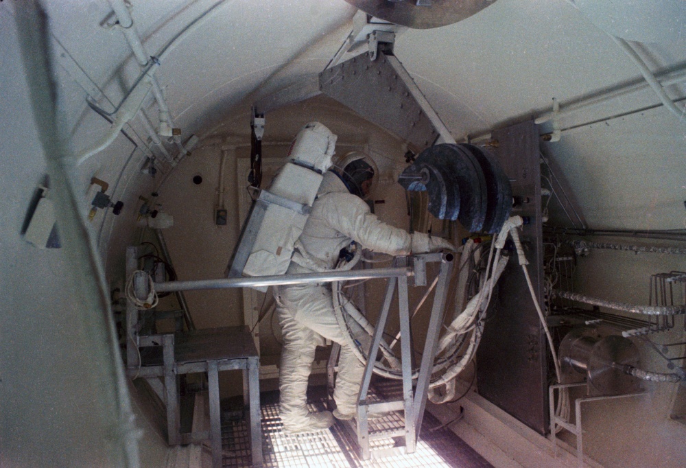 In preparation for the Apollo 9 spacewalk, astronaut Russell L. Schweickart tests the Portable Life Support System backpack in an altitude chamber at the Manned Spacecraft Center (MSC), now NASA’s Johnson Space Center in Houston