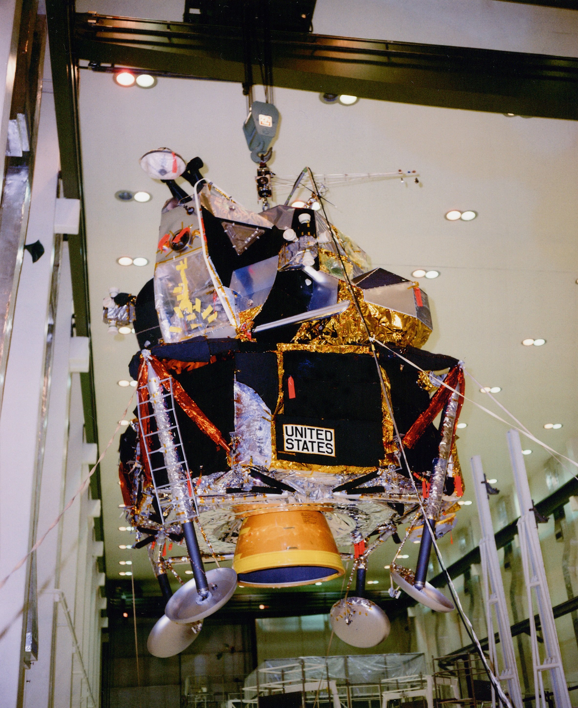 In KSC’s Manned Spacecraft Operations Building (MSOB), workers remove the Lunar Module (LM) from an altitude chamber