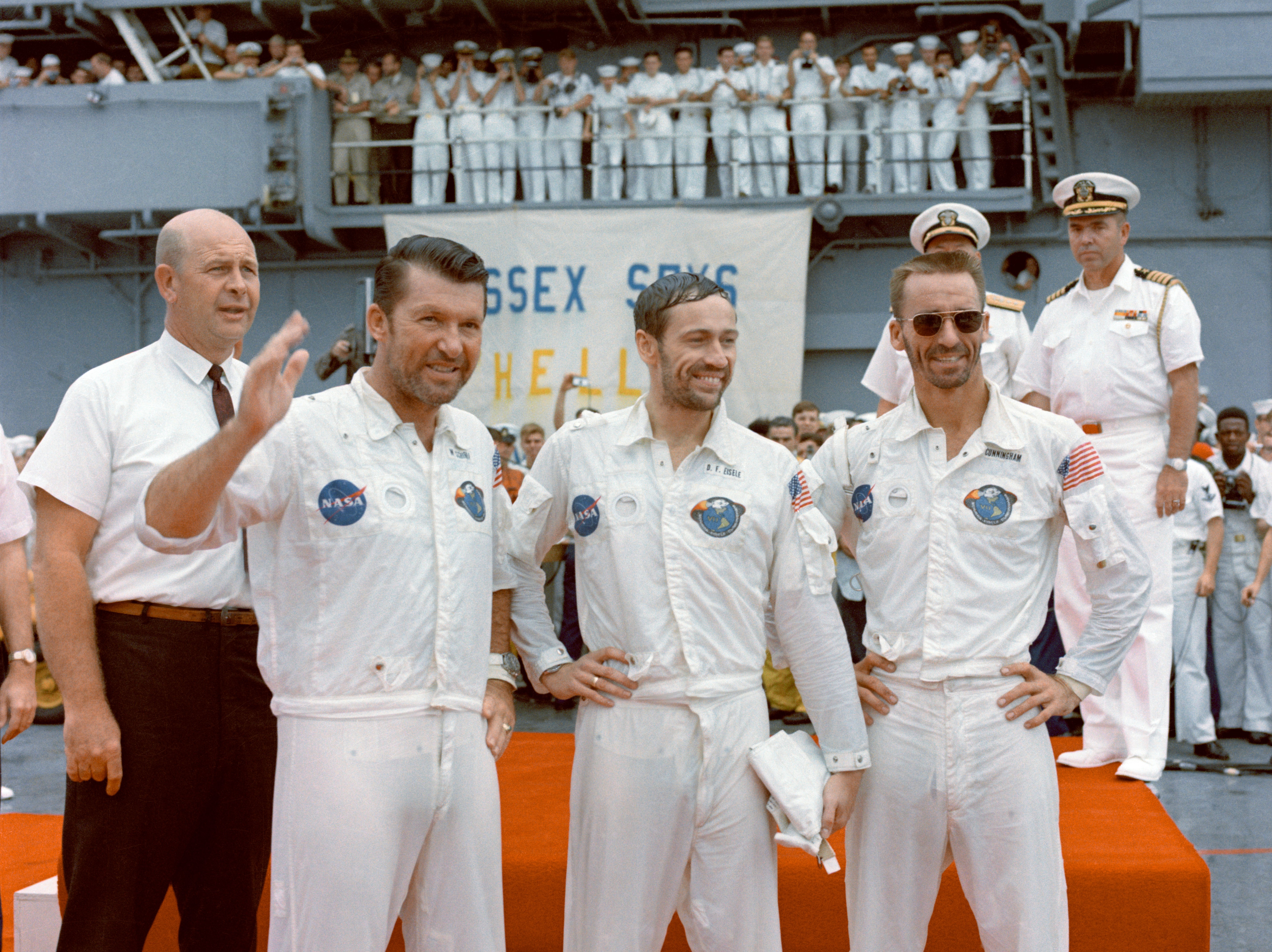 Apollo 7 astronauts Walter M. Schirra, left, Donn F. Eisele, and R. Walter Cunningham on the recovery ship USS Essex following their 11-day mission