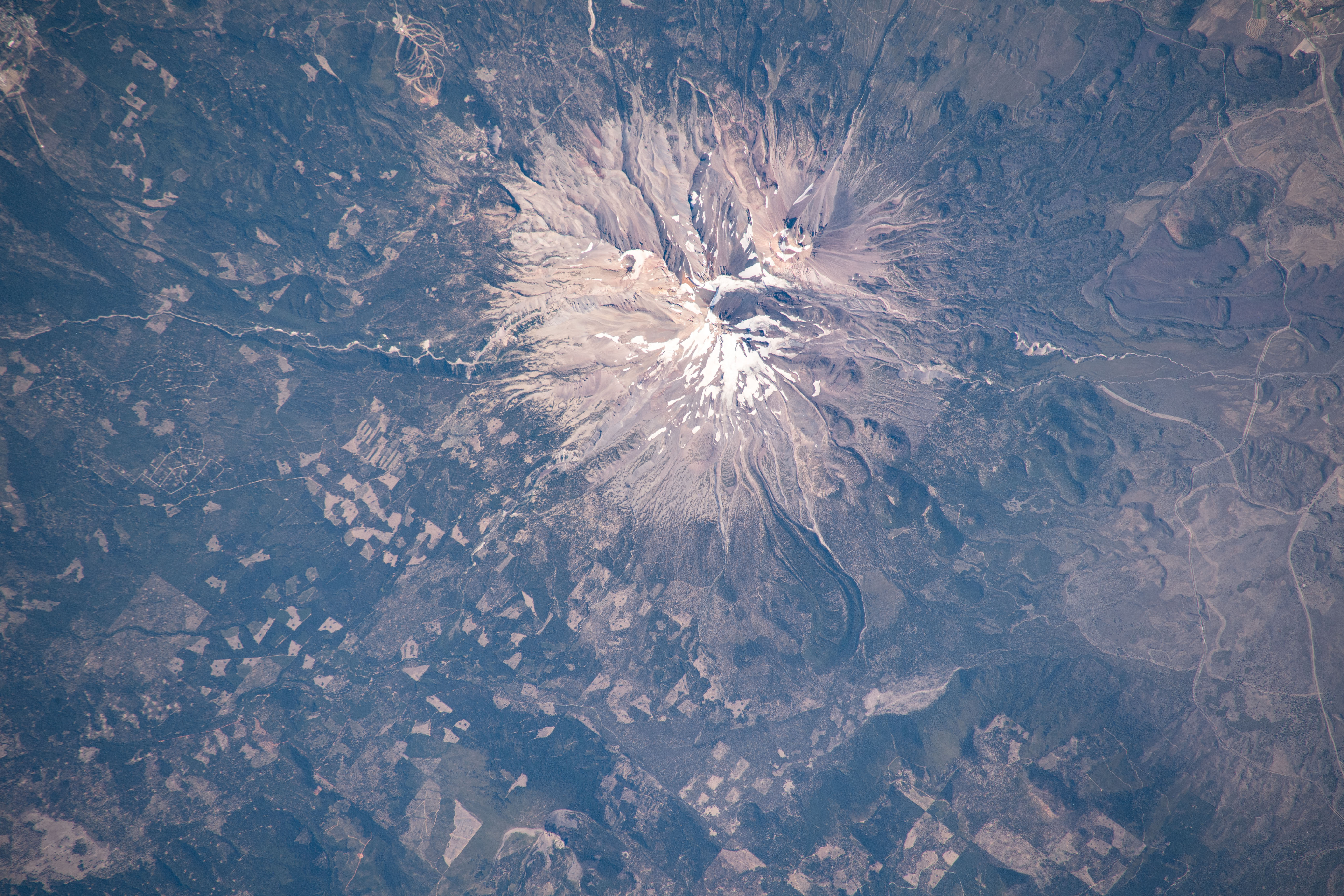 Mount Shasta, a potentially active volcano surrounded by the Shasta-Trinity National Forest in northern California, is pictured from the International Space Station as it orbited above the western United States.