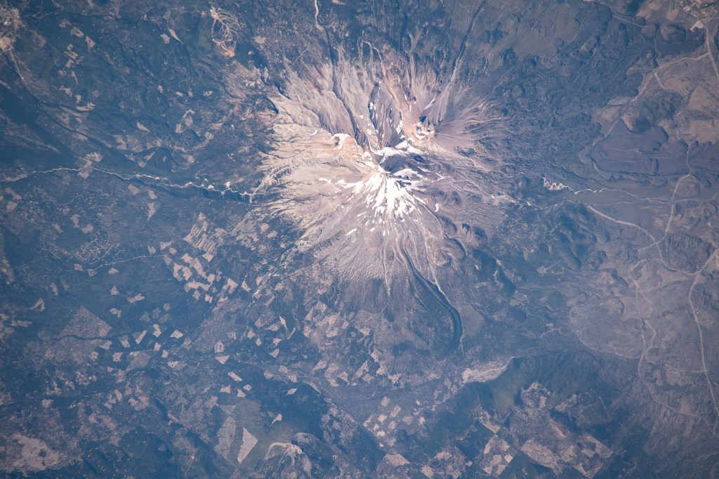 Mount Shasta, a potentially active volcano surrounded by the Shasta-Trinity National Forest in northern California, is pictured from the International Space Station as it orbited above the western United States.
