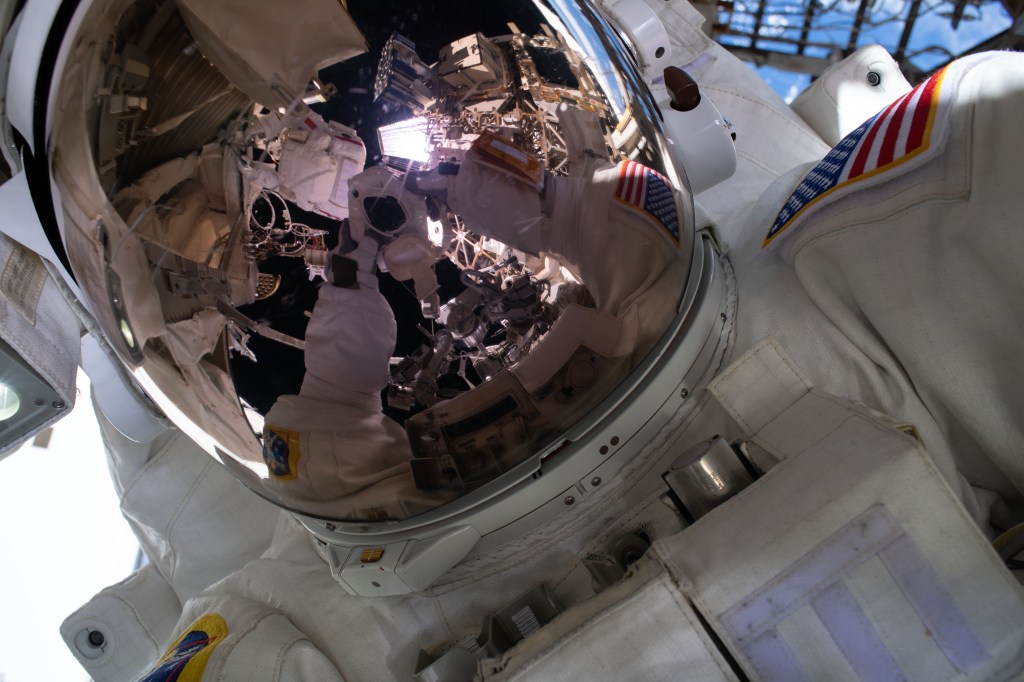 NASA astronaut and spacewalker Andrew Morgan takes an out-of-this-world "space-selfie" with his spacesuit's helmet visor down during the second spacewalk to repair the International Space Station's cosmic particle detector, the Alpha Magnetic Spectrometer.