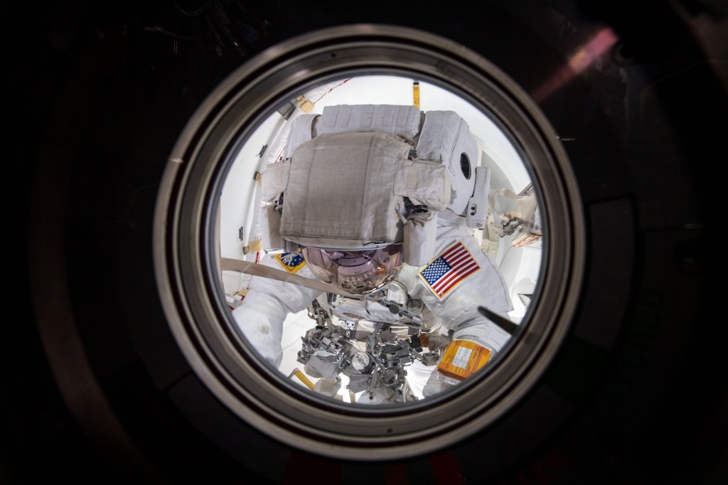 NASA astronaut Andrew Morgan is pictured in his U.S. spacesuit inside the crew lock portion of the Quest joint airlock. He and ESA (European Space Agency) astronaut Luca Parmitano worked outside in the vacuum of space for six hours and 33 minutes during the second spacewalk to repair the Alpha Magnetic Spectrometer's thermal control system.