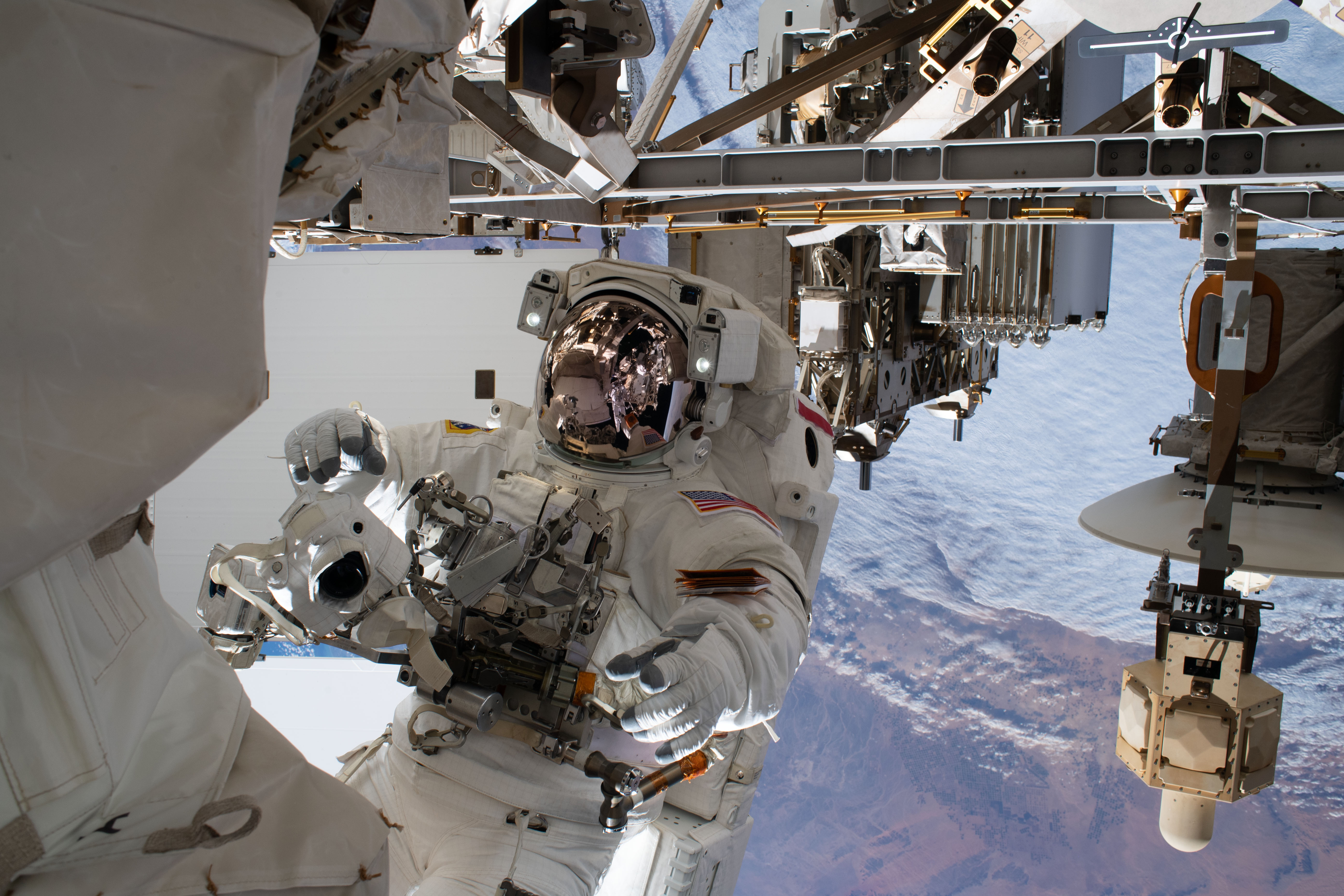 NASA astronaut Andrew Morgan is pictured tethered to the International Space Station while finalizing thermal repairs on the Alpha Magnetic Spectrometer, a dark matter and antimatter detector, during a spacewalk that lasted 6 hours and 16 minutes.