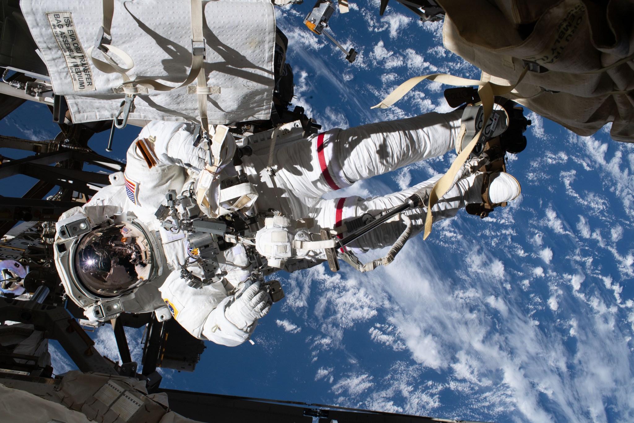 NASA astronaut Andrew Morgan is pictured tethered to the International Space Station while finalizing thermal repairs on the Alpha Magnetic Spectrometer, a dark matter and antimatter detector, during a spacewalk that lasted 6 hours and 16 minutes.