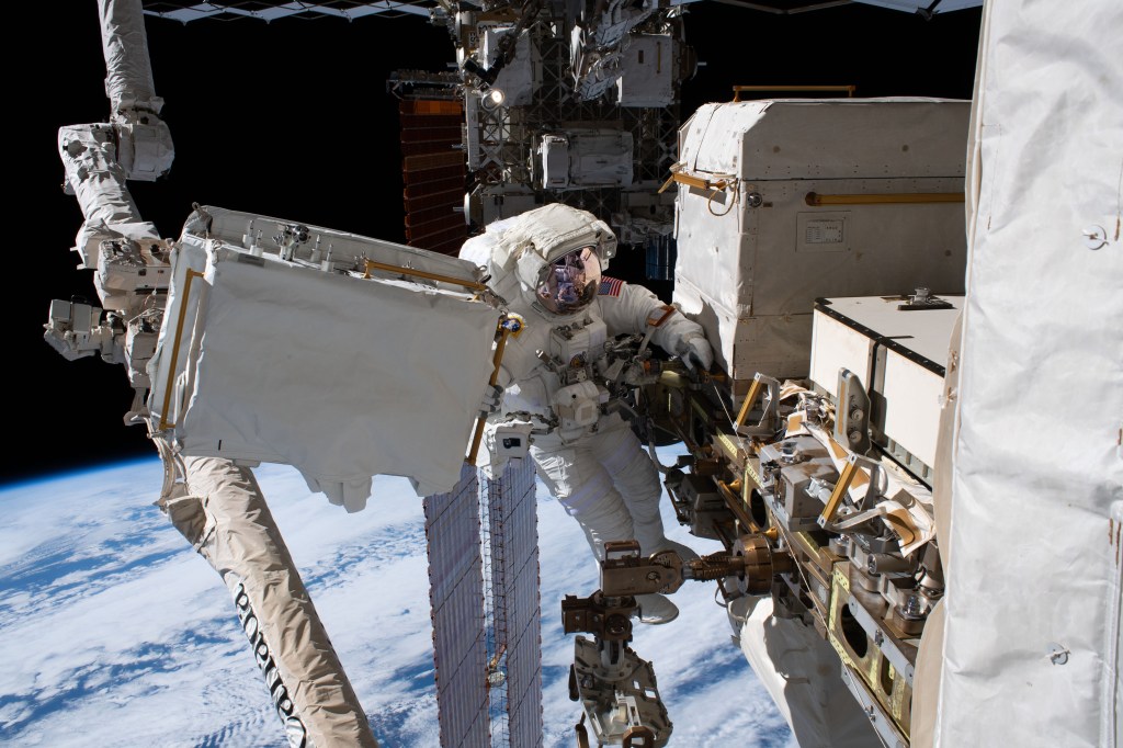 NASA astronaut Andrew Morgan is tethered to the International Space Station with the Earth 250 miles below during the third spacewalk to upgrade the Alpha Magnetic Spectrometer's thermal pump system.