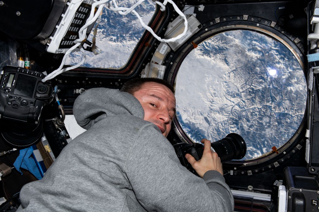 NASA astronaut and Expedition 61 Flight Engineer Andrew Morgan photographs the Earth below as the International Space Station orbited 261 miles above Russia just north of the Mongolian border.