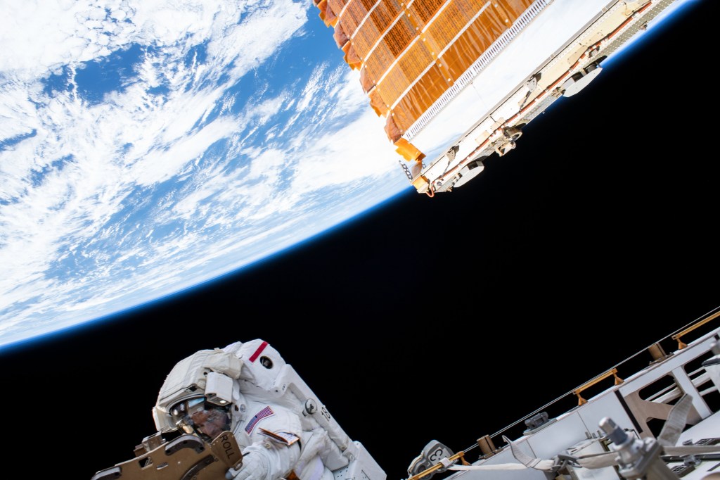 With the Earth 250 miles below him, NASA astronaut Andrew Morgan works on the Port 6 truss segment of the International Space Station to replace older hydrogen-nickel batteries with newer, more powerful lithium-ion batteries. Fellow NASA astronaut Christina Koch (out of frame) assisted Morgan during the six-hour and 45-minute spacewalk.