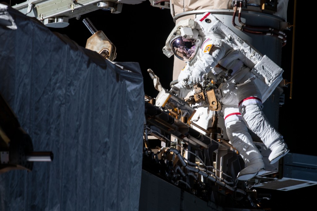 NASA astronaut Andrew Morgan works while tethered on the Port 6 truss segment of the International Space Station to replace older hydrogen-nickel batteries with newer, more powerful lithium-ion batteries. Fellow NASA astronaut Christina Koch (out of frame) assisted Morgan during the six-hour and 45-minute spacewalk.