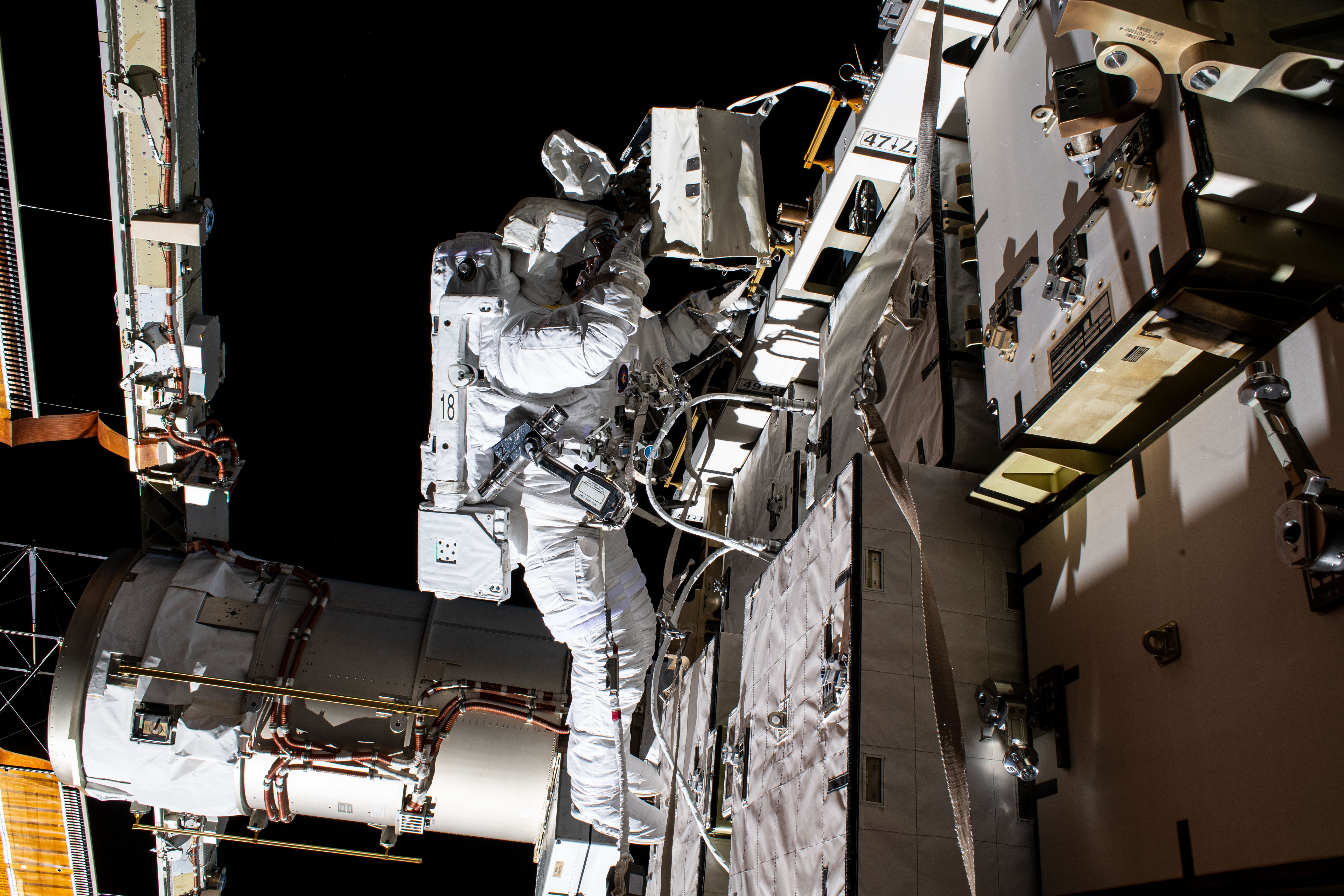 NASA astronaut Bob Behnken is pictured during a spacewalk to swap batteries and upgrade power systems on the International Space Station's Starboard-6 truss structure. Behnken was joined during the six-hour and seven-minute excursion by NASA astronaut Chris Cassidy (out of frame).