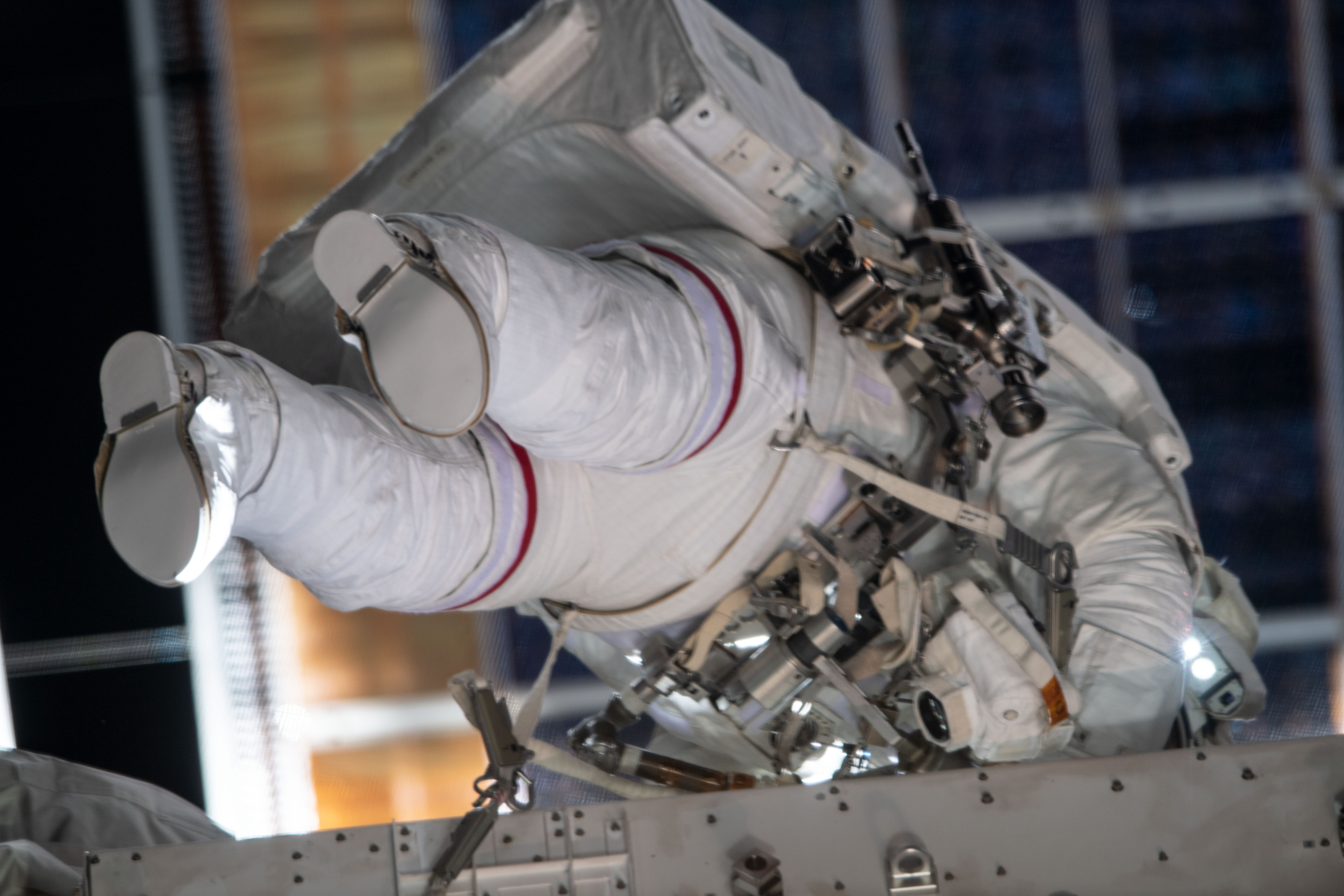 NASA astronaut Christina Koch conducts her fourth spacewalk at the International Space Station. She and fellow NASA astronaut Jessica Meir (out of frame) ventured into the vacuum of space for seven hours and 17 minutes to swap a failed battery charge-discharge unit (BCDU) with a spare during the first all-woman spacewalk. The BCDU regulates the charge to the batteries that collect and distribute solar power to the orbiting lab’s systems.