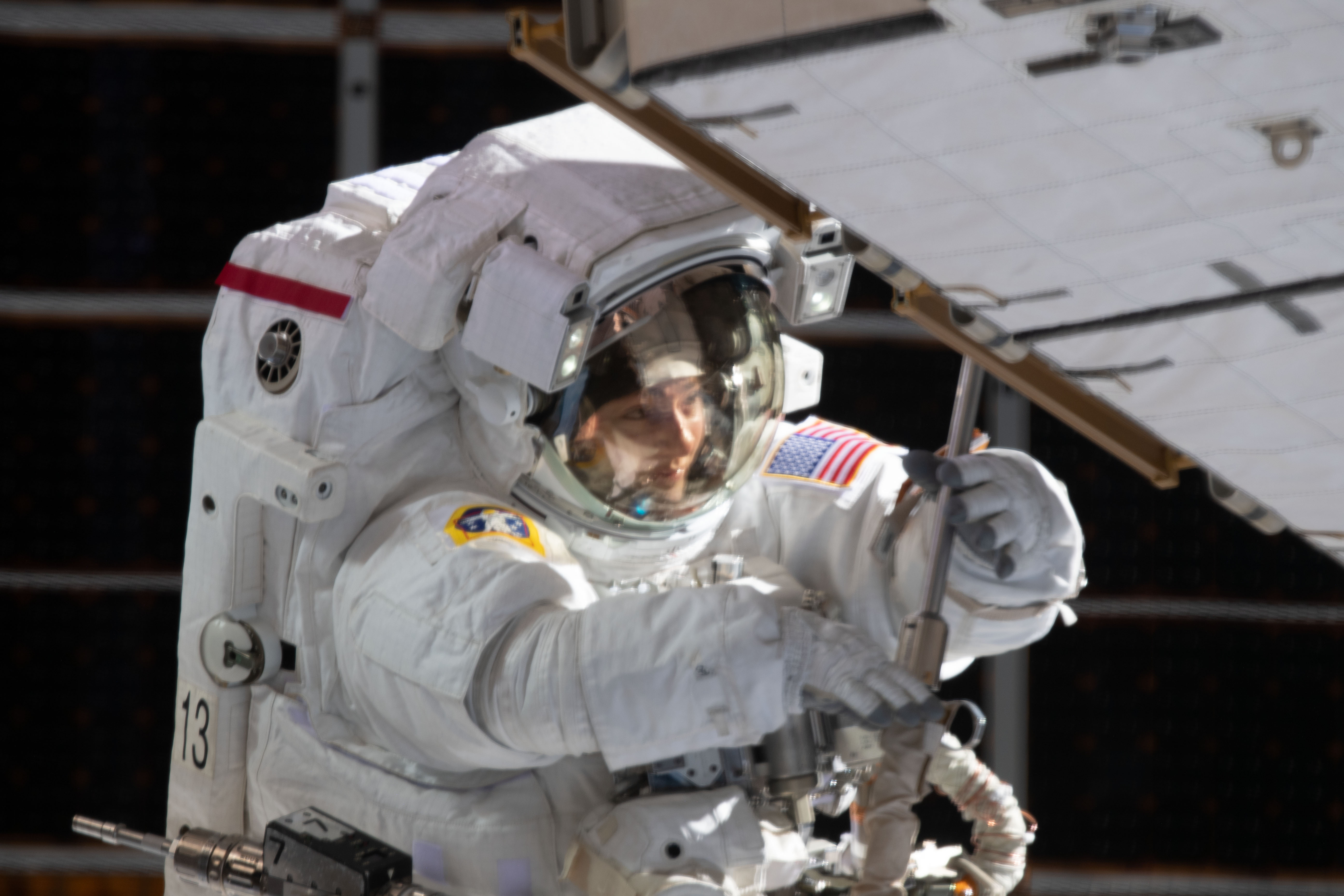 NASA astronaut Jessica Meir is pictured during a spacewalk she conducted with NASA astronaut Christina Koch (out of frame) to install new lithium-ion batteries that store and distribute power collected from solar arrays on the station’s Port-6 truss structure.