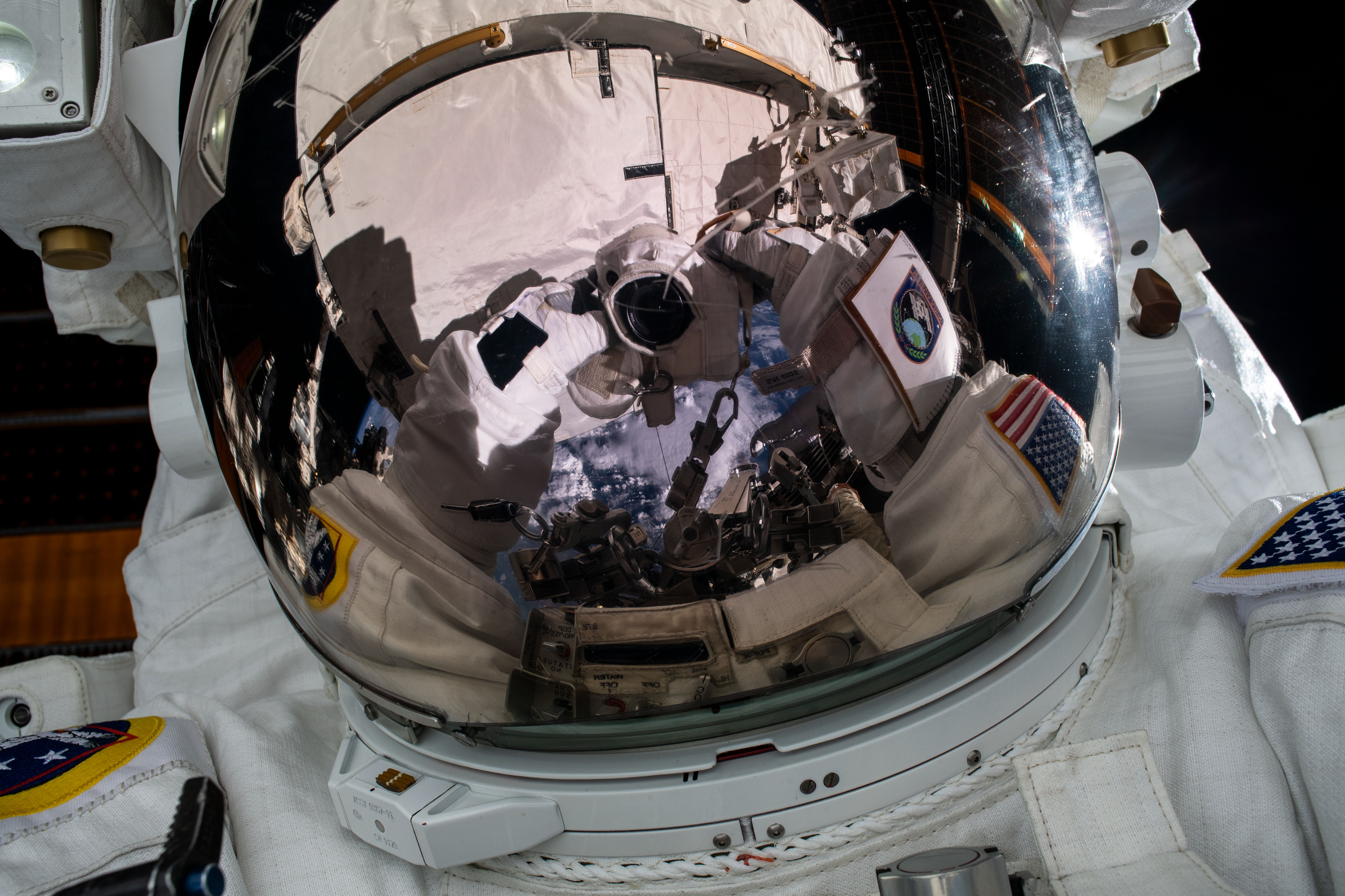 NASA astronaut Jessica Meir takes an out-of-this-world "space-selfie" during a spacewalk she conducted with NASA astronaut Christina Koch (out of frame) to install new lithium-ion batteries that store and distribute power collected from solar arrays on the station’s Port-6 truss structure.