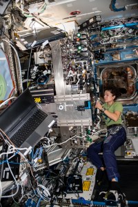 NASA astronaut Jessica Meir of Expedition 61 works on components of the Combustion Integrated Rack aboard the International Space Station's U.S. Destiny laboratory module.