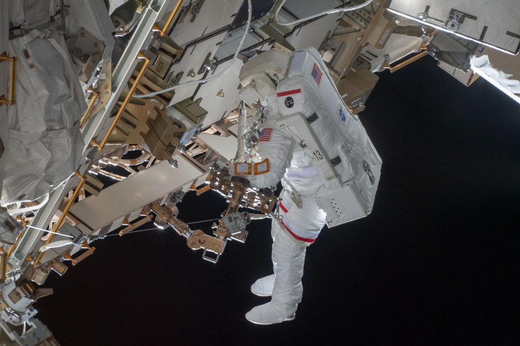 NASA astronaut Nick Hague participates in his second spacewalk to upgrade the International Space Station's power storage capacity. He and fellow spacewalker Christina Koch (out of frame) of NASA worked outside in the vacuum of space for six hours and 45 minutes to continue swapping batteries and install adapter plates on the station's Port-4 truss structure.