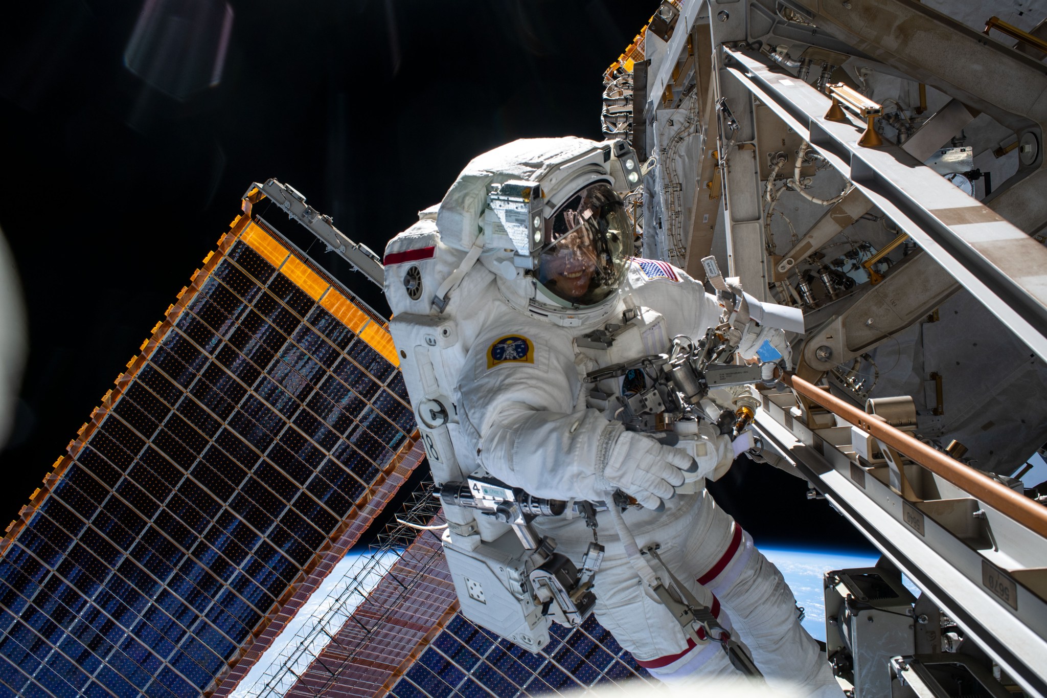 iss068e045241 (Feb. 2, 2023) --- NASA astronaut and Expedition 68 Flight Engineer Nicole Mann is pictured in her Extravehicular Mobility Unit, or spacesuit, during her second spacewalk. She and fellow spacewalker Koichi Wakata (out of frame) of the Japan Aerospace Exploration Agency (JAXA) installed a modification kit on the International Space Station's starboard truss structure that will enable the future installation of the orbiting lab's next roll-out solar array.
