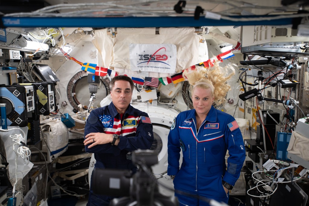 NASA astronauts Chris Cassidy and Kate Rubins are pictured inside the JAXA (Japan Aerospace Exploration Agency) Kibo laboratory module calling down to Earth and talking to former Canadian Space Agency astronaut Julie Payette, now Governor-General of Canada.