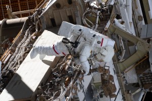NASA spacewalker Anne McClain works on the International Space Station's Port-4 truss structure during a six-hour, 39-minute spacewalk to upgrade the orbital complex's power storage capacity.